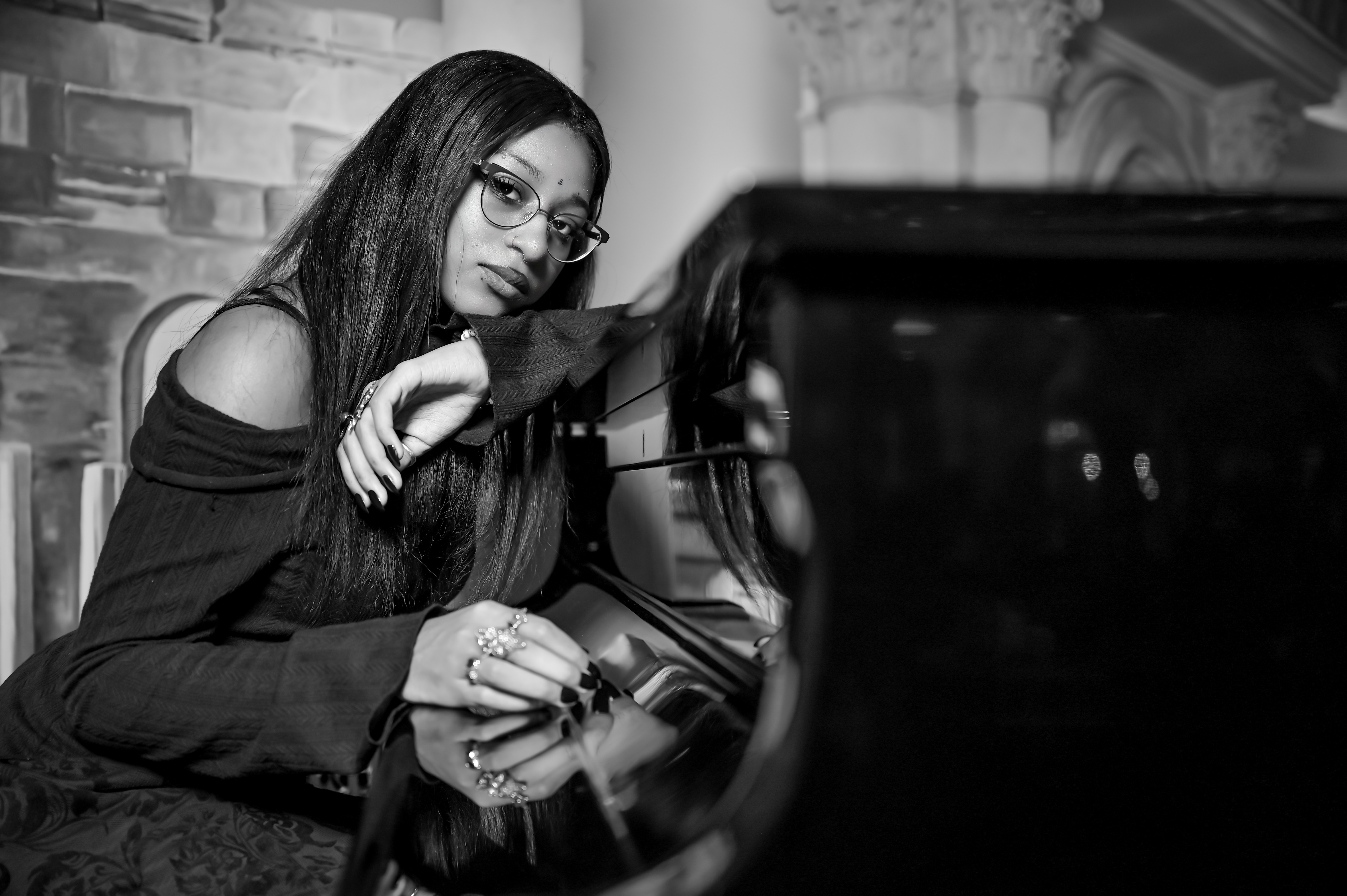 Black-and-white portrait of Alanna Crouch at a piano.